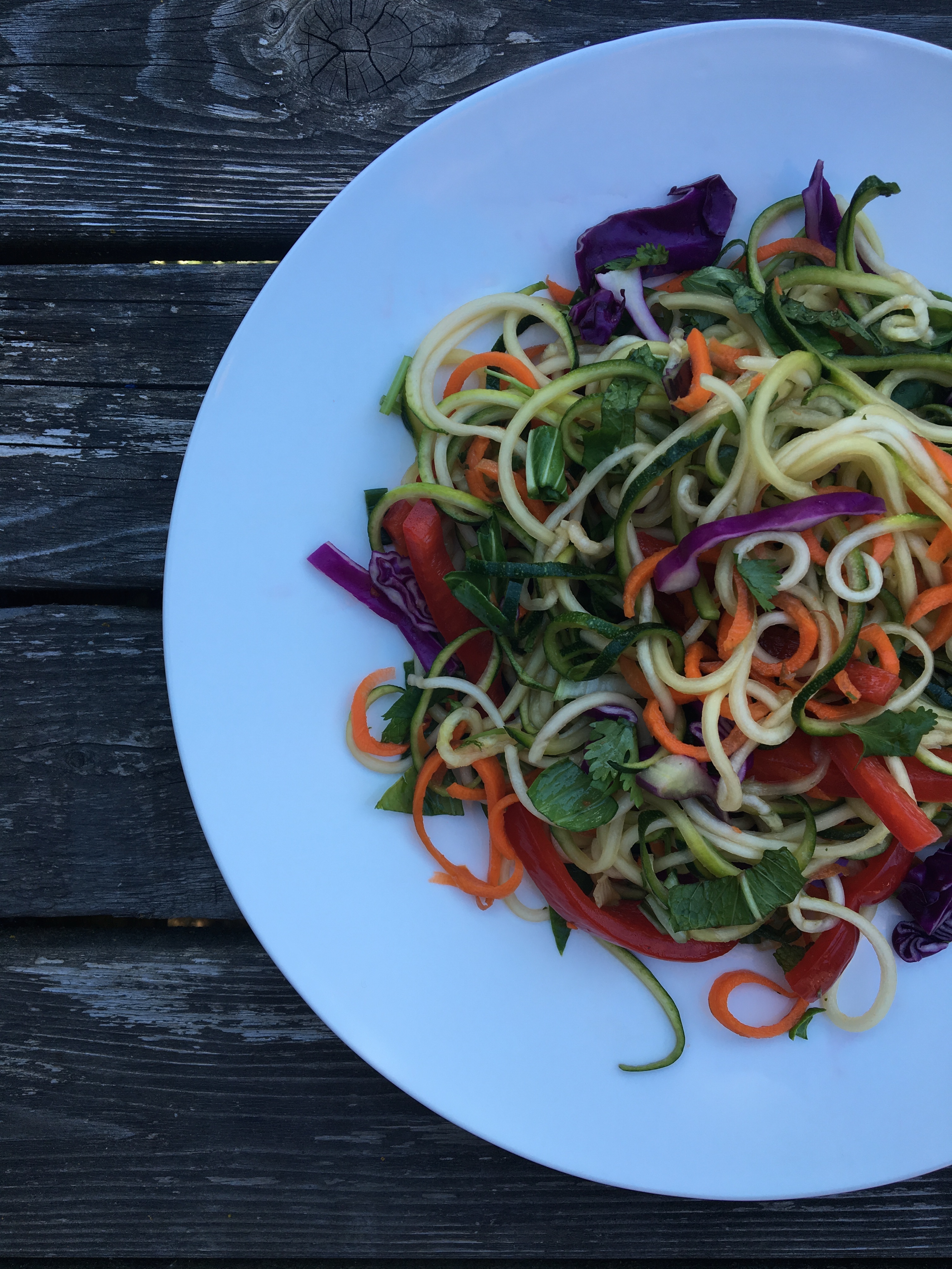 Thai Zucchini Noodle Salad with spiralized zucchini and carrots, bok choy, purple cabbage, red bell pepper, green onions, and a lime vinaigrette